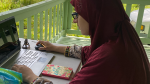 Cohoes senior Hamnah Abbas works remotely.