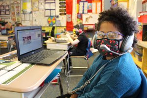 Van Schaick student watches Career Week presentation.