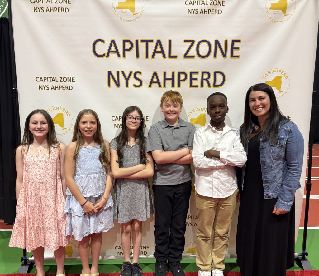 Abram Lansing students Paige Yando, Lucy Frank, Lilianna Jackson, Landon Sass, Amarni Roberts and PE teacher Valerie Lang.