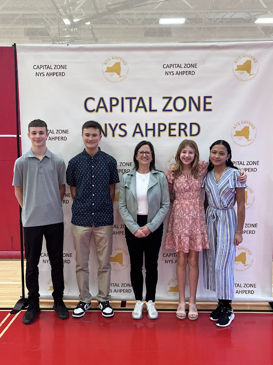 Ryan Alonzo, Nicholas Grestini, PE teacher Terry Gendron, Caeleigh Schumacher, Mila Wattsman. (Not pictured: Ginoshka Gonzalez-Figueroa and Arthur Meissner).
