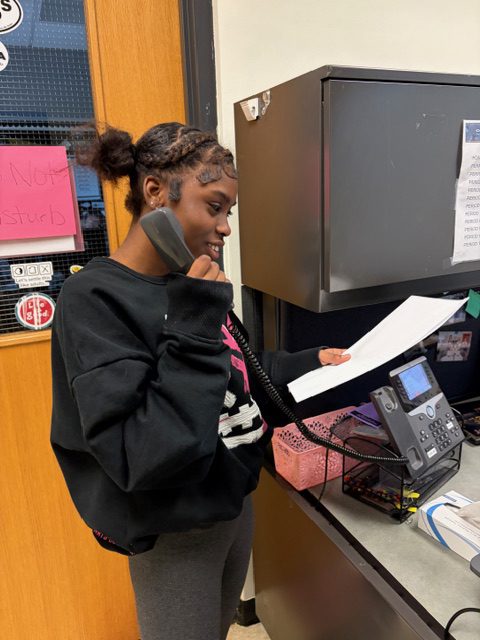 Paris Lawton motivates her peers to arrive on time during the announcements.