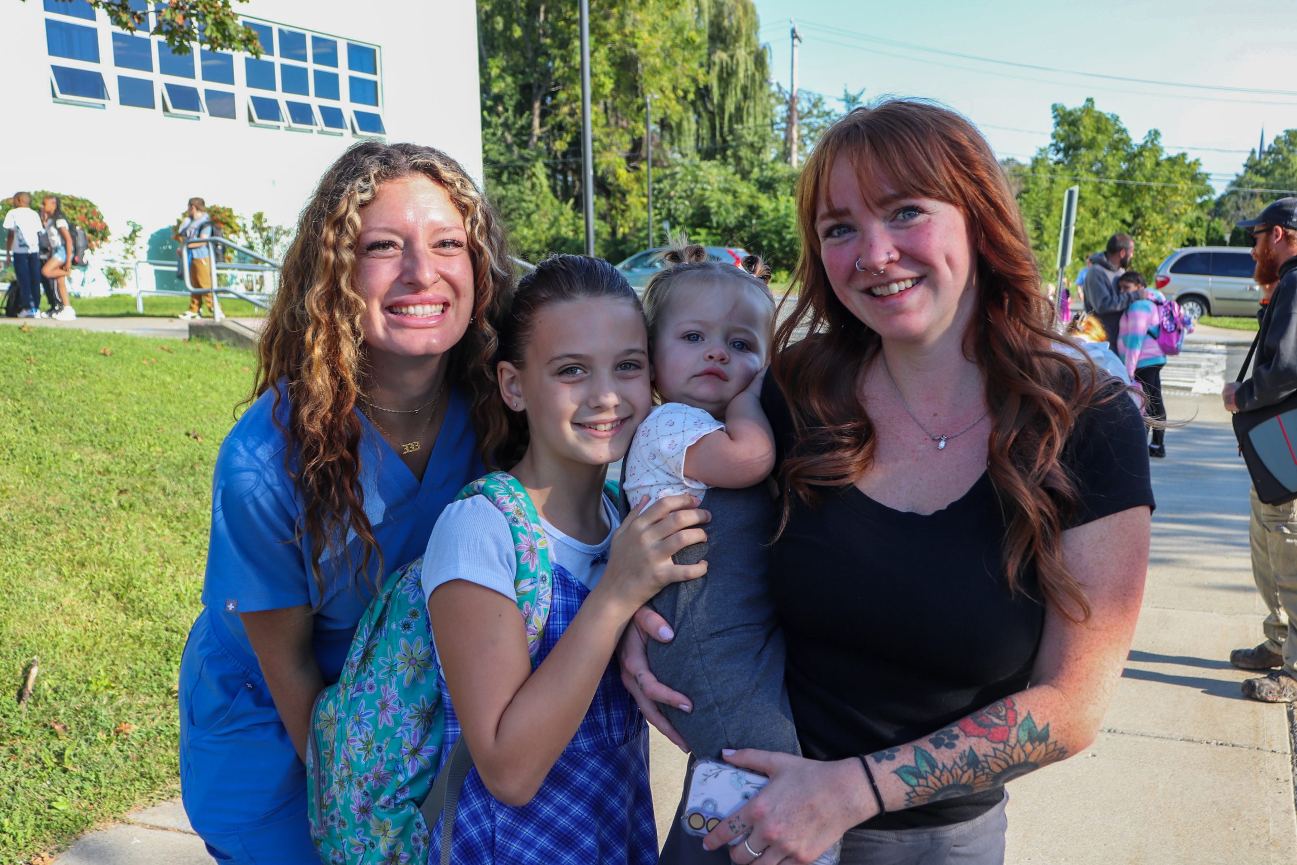 Five students from Abram Lansing Elementary School smile
